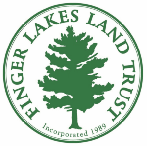 Circular Green Lakes Land Trust logo with a green evergreen tree in the center and 'Incorporated 1989' text along the bottom edge.